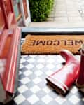 Welcome mat and wellington boots