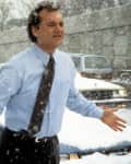Bill Murray runs through the snow in a scene from the film 'Groundhog Day', 1993.