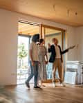 Real Estate Agent Guides Homebuyers During Viewing