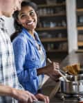 Couple cooking together in kitchen