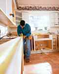 Man doing work renovating a vintage kitchen