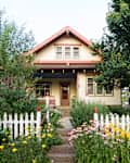 Bungalow House with White Picket Fence