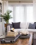 Living room interior with white sofas