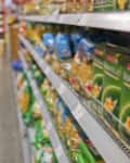 a woman in the purchase of food in a supermarket. everyday life of a housewife