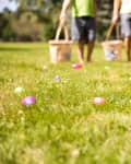 Blurred silhouettes of children with baskets in hands. the concept of family fun at Easter. blurred background.