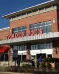 Trader Joe's exterior and sign. Trader Joe's is an American privately held chain of specialty grocery stores headquartered in Monrovia, CA.