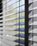 Office blinds. Modern wooden jalousie. Office meeting room lighting range control.