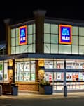 BAYPORT, MN/USA - FEBRUARY 22, 2020: Aldi grocery store at night and trademark logo.