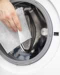 soft your laundry by droping dryer sheets into your dryer or washing mashine by hand, so it will smell fresh