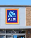 A shot of an Aldi food market sign that's bright and colorful with a blue sky in Hutchinson Kansas USA that was on 9-13-2020.