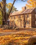 A historic colonial structure in Concord, MA on an October day