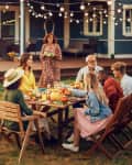 Family and Multiethnic Diverse Friends Gathering Together at a Garden Table. People Cooking Meat on a Fire Grill, Preparing Tasty Salads for a Big Family Celebration with Relatives.