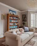 Cambridge, England - August 24 2018: Luxury traditional furnished victorian living room with modern furniture bay window