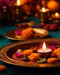 During Diwali, clay diya oil lamps are lit, blazing, or illuminated against a dark bokeh background at home. Idea for Hindu festivals in India, ceremonial worship, and customs.