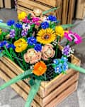 Prague, Czech Republic - April 22, 2024: Lego constructor plastic flowers The Botanical Collection in a wooden box.