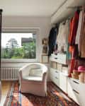Interior, comfortable bedroom with wardrobe and armchair