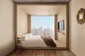 Minimalist bedroom with a city view, featuring a bed, wall-mounted TV, side table with a plant, and ornate wall decor.