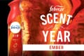 Febreze Air Ember spray with vibrant red and orange marbled background, labeled "Scent of the Year."