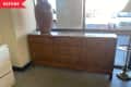 before image of dresser with flag in top left corner
