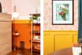 Room with orange and yellow walls, floor lamp, wooden shelves, boots, and framed artwork on floral wallpaper.