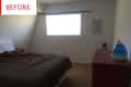Bedroom with brown comforter, red nightstand, humidifier on dresser, and window with blinds.