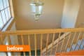 Staircase with wooden railing, beige walls, large window, and hanging light fixture. Orange "before" label in corner.