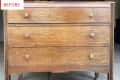 Wooden dresser with three drawers and square knobs, labeled "Before."