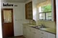 Old kitchen with wooden door, white cabinets, and a window above the sink.