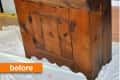Wooden cabinet with a rustic finish, labeled "before," on a white sheet in a room.