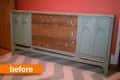 Mid-century modern sideboard with worn wood drawers and green cabinet doors against a red wall, labeled "before."