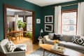 a deep green living room with a gray couch