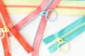 4 different pastel-colored zippers