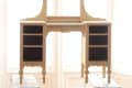 Wooden vanity frame on sawhorses in front of large windows, ready for restoration.