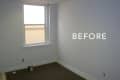 Empty room with white walls, a window, and a paint can on the floor labeled "BEFORE."
