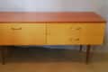 Mid-century modern sideboard with wooden top and yellow drawers, labeled "Before" on the left.