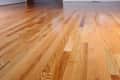 Polished hardwood floor with natural wood grain pattern.