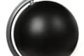 Black globe with a silver stand and axis, minimalist design.