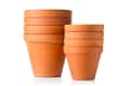 Stack of terracotta plant pots in varying sizes.