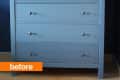 Blue wooden dresser with six drawers and round knobs against a dark blue wall, labeled "before."