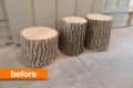 Three tree stumps used as stools against a paneled wall.