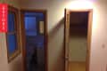 Dimly lit hallway with open doors to a bathroom and closet, wooden trim, and a "Before" label on the left.
