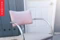 Metal chair with pink cushioned back and seat on a concrete patio, labeled "Before."