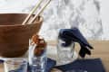 Simple, everyday drinking glasses by Duralex arranged on a table with a large salad bowl and cloth napkins
