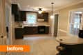 Spacious kitchen with dark cabinets, tile floor, and a small island, featuring a window and ceiling light fixture.