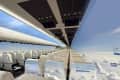 Airplane cabin with transparent walls and ceiling, offering panoramic views of clouds and sky.