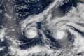 Two hurricanes swirling over the Pacific Ocean, captured from space.