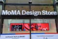 MoMA Design Store entrance with a digital display featuring a drone and countdown timer for La French Tech event.