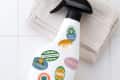 cleaning spray bottle with stickers on it