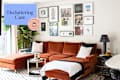 Cozy living room featuring an orange velvet sectional sofa, decorative pillows, a coffee table, and a gallery wall of framed art.