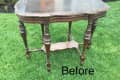 Ornate wooden table with curved edges and turned legs on grass, labeled "Before."